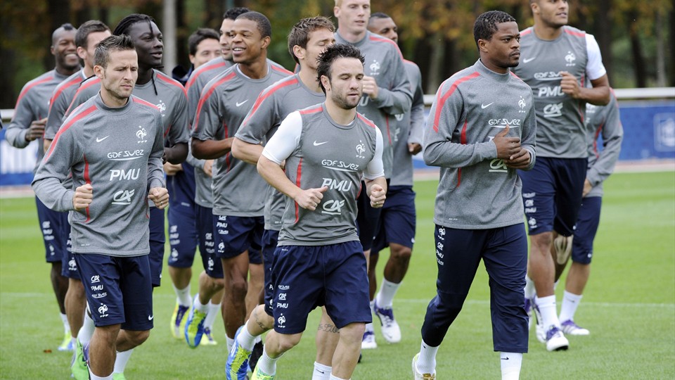 Soccer players jogging as a warmup exercise